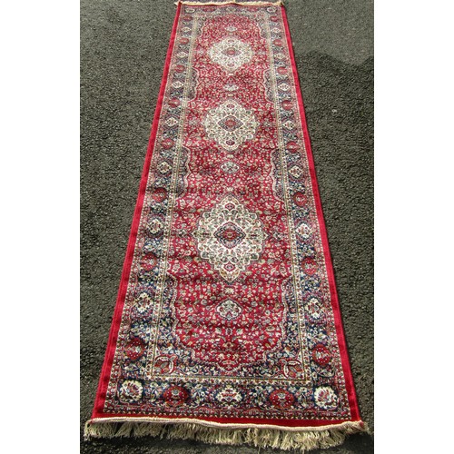 1520 - A Kashmir runner with a full pile red ground, 300cm x 80cm