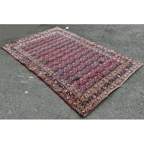 1513 - An old Doroskh rug with a tight Paisley design in blue and red tones, 222cm x 140cm