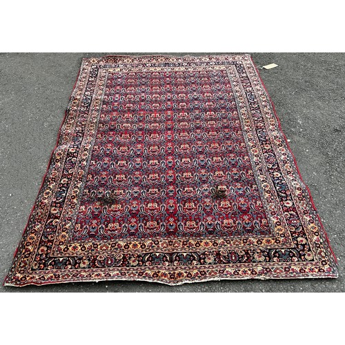 1513 - An old Doroskh rug with a tight Paisley design in blue and red tones, 222cm x 140cm