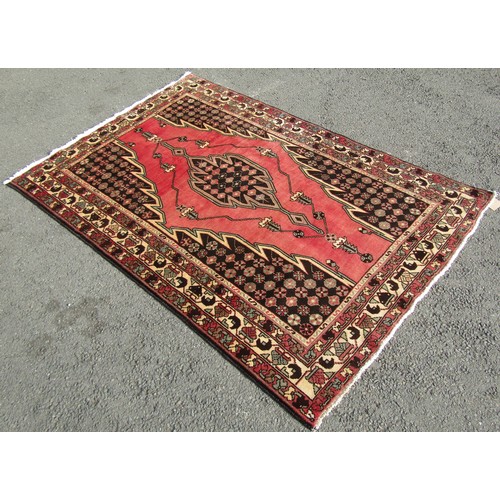 1530 - A Persian Hamadan carpet with washed red ground, fine woven pile with a central medallion, 195cm x 1... 