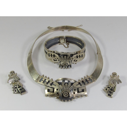 368 - Mexican stylised silver jewellery suite comprising collar necklace, cuff bracelet and pair of drop e... 