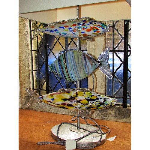 130 - An unusual mid-century Murano glass fish lamp, with three fish swimming below the square cut shade a... 