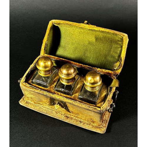 396 - An 18th century velvet and brass mounted casket containing three cut glass scent bottles

By family ... 