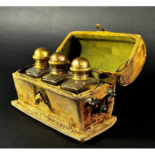 396 - An 18th century velvet and brass mounted casket containing three cut glass scent bottles

By family ... 