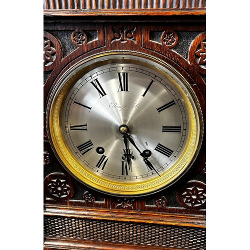 445A - Elkington & Company, an oak cased bracket clock in the Aesthetic Movement manner, the silvered dial ... 