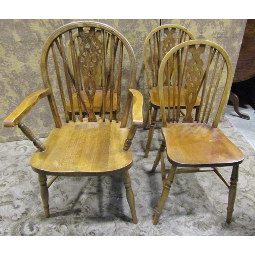 1075 - A set of four (3&1) Windsor stained beechwood wheelback dining chairs together with two rush seated ... 