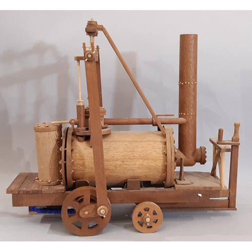 825 - Working scratch-built model of an early steam locomotive, all hand made in teak with switch operated... 