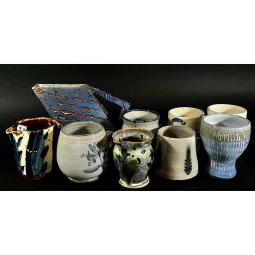 117 - A large quantity of Studio Pottery ware comprising mugs, open bowls, etc including works by Steve Mi... 