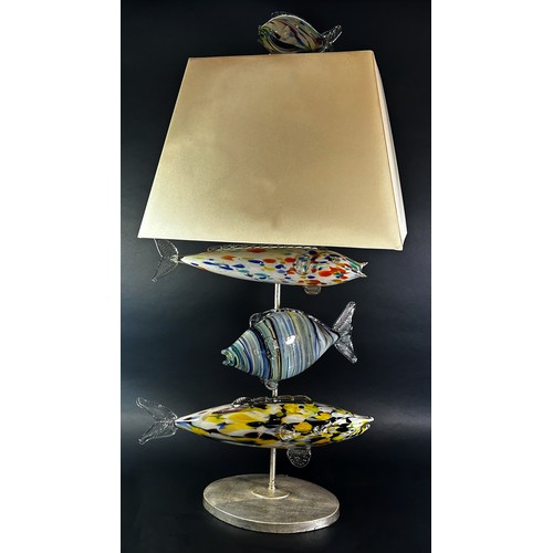 130 - An unusual mid-century Murano glass fish lamp, with three fish swimming below the square cut shade a... 