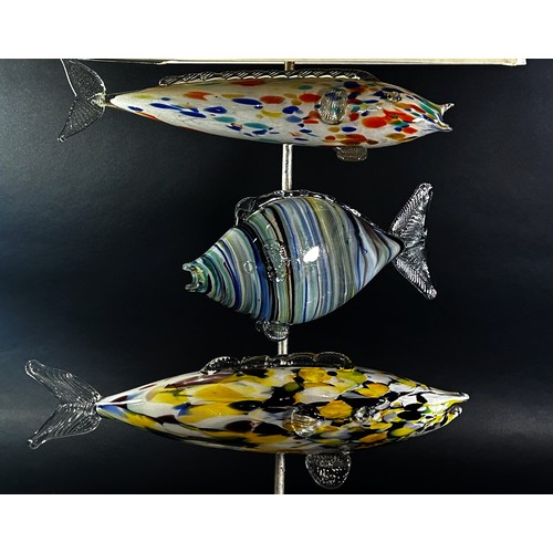 130 - An unusual mid-century Murano glass fish lamp, with three fish swimming below the square cut shade a... 