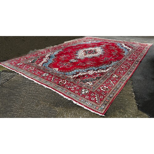 1528A - A very large Country House Persian Carpet, with an extended central floral medallion and trailing fl... 