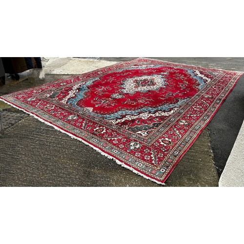 1528A - A very large Country House Persian Carpet, with an extended central floral medallion and trailing fl... 