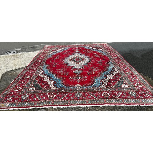 1528A - A very large Country House Persian Carpet, with an extended central floral medallion and trailing fl... 