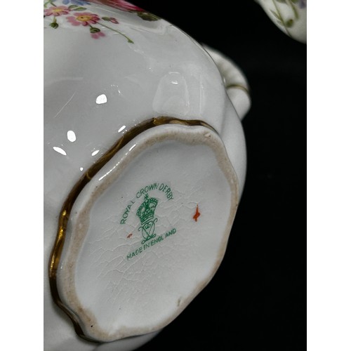 107 - A Royal Crown Derby coffee set for six with floral bouquet details