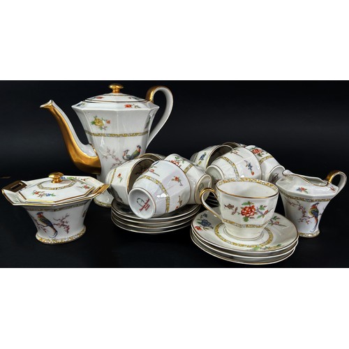 129 - A Limoges porcelain coffee set decorated with exotic pheasants - 9 cups & 12 saucers, coffee pot, su... 