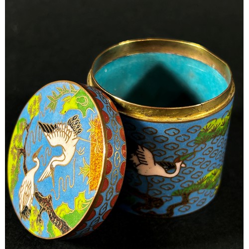 503 - A miniature Cloisonné cylindrical pot and cover, decorated with cranes amongst clouds and prunus, 4.... 