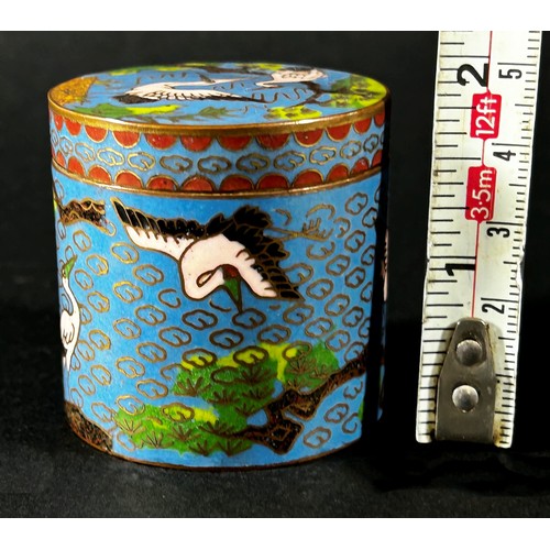 503 - A miniature Cloisonné cylindrical pot and cover, decorated with cranes amongst clouds and prunus, 4.... 