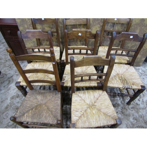 1078 - A set of seven matching early 20th century rush seat refectory dining chairs and a single similar, (... 