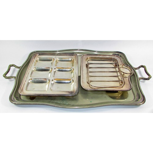 264B - A miscellaneous collection of silver plated table ware, including two trays, a cooling rack, a wine ... 