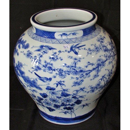 124 - A Chinese blue & white vase of bulbous form (30cm tall x 28cm wide) with apocryphal reign marks to u... 