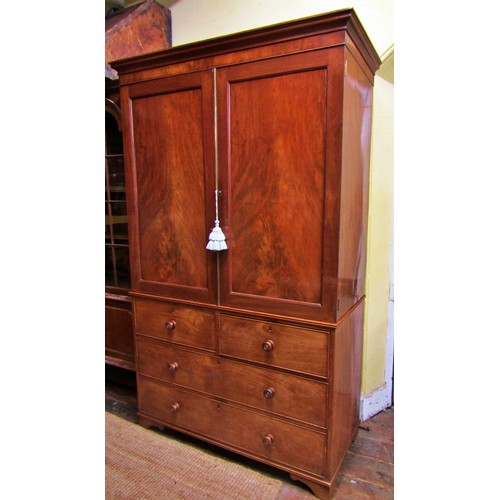 1357 - An early 19th century mahogany linen press of two long and two short drawers, enclosed by two matche... 