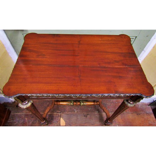 1368 - A decorative mahogany centre table raised on four turned and fluted supports with central stretcher,... 