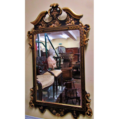 1370 - An 18th century style wall mirror with chinoiserie detail frame in black and gilt, set beneath a mou... 