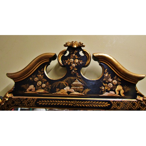 1370 - An 18th century style wall mirror with chinoiserie detail frame in black and gilt, set beneath a mou... 