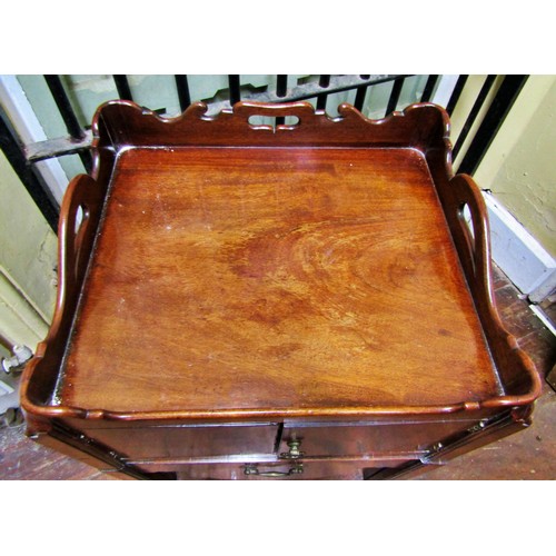 1372 - A Georgian mahogany tray top commode, enclosed by two doors on moulded supports, 56cm wide x 48cm de... 