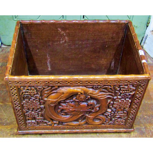 1376 - A Chinese carved rectangular hardwood box, with dragon, cloud and other detail, within a geometric b... 