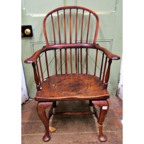 1478 - An 18th century Windsor elbow chair principally in part yew and fruit wood, on shaped forelegs and t... 