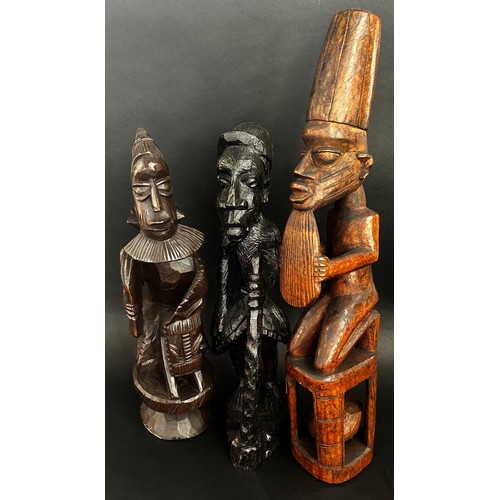 1740 - A group of African / likely Nigerian / Yoruba hardwood carvings to include a small bowl with figural... 