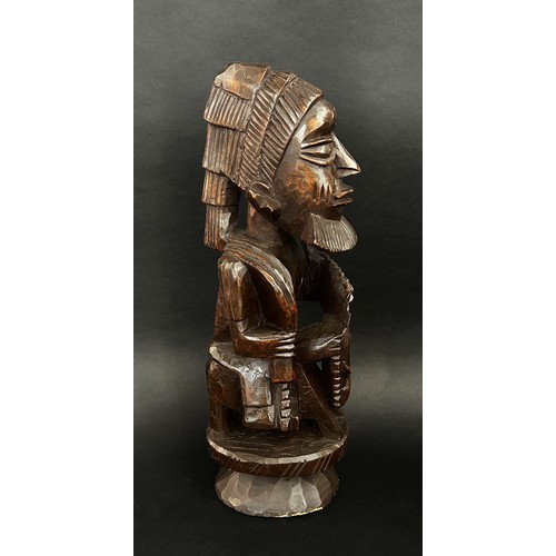 1740 - A group of African / likely Nigerian / Yoruba hardwood carvings to include a small bowl with figural... 