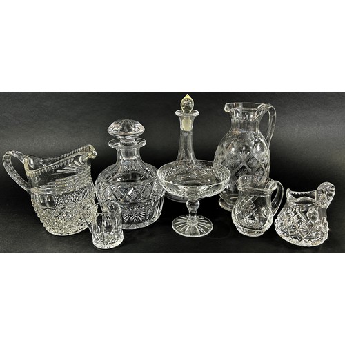 152 - A mixed selection of 19th and 20th century glassware including decanters, jugs, sets of matching gla... 