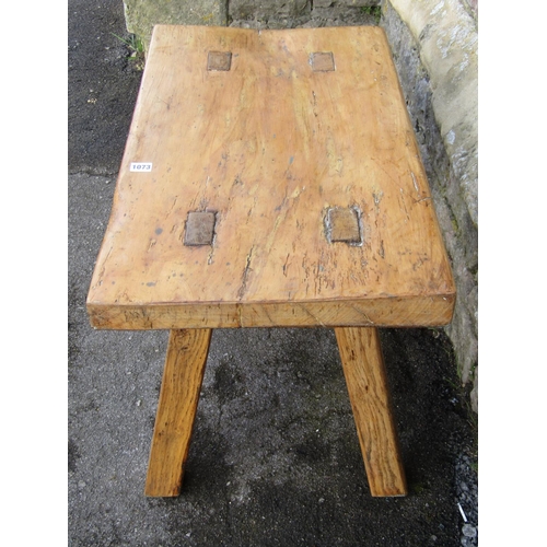 1073 - An old wooden pig bench on four square oak pegged supports, 77cm x 44cm x 48 cm high.