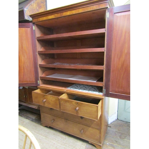 1357 - An early 19th century mahogany linen press of two long and two short drawers, enclosed by two matche... 