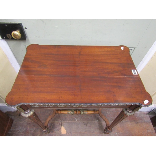 1368 - A decorative mahogany centre table raised on four turned and fluted supports with central stretcher,... 