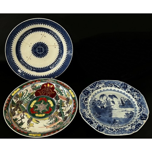 57 - A group of Chinese 18th and 19th century export dishes and plates to include a meat platter with lan... 