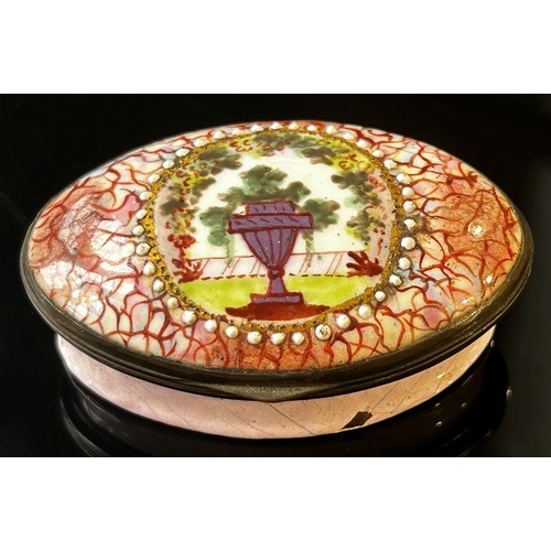 391 - A Georgian pink enamel Bilston box oval with urn and landscape detail