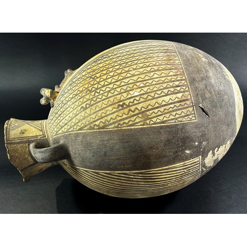 1744 - A large (possibly) pre-Colombian terracotta effigy vessel, of ovoid form with twin handles, with str... 