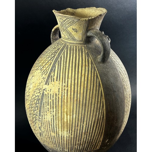 1744 - A large (possibly) pre-Colombian terracotta effigy vessel, of ovoid form with twin handles, with str... 