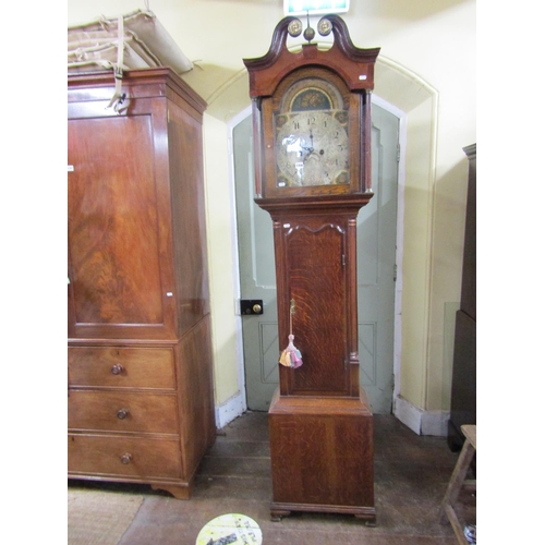 1356 - A Georgian oak longcase clock, the hood with swan neck pediment enclosing a broken arch painted dial... 