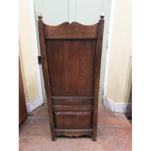 1482 - An old English style oak lambing type chair with winged and fielded panelled back over a drawer base