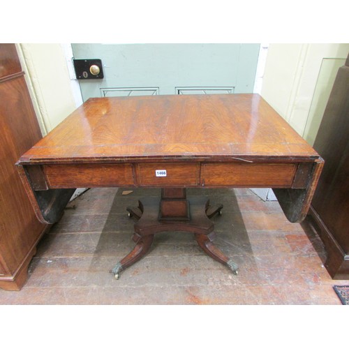 1466 - A Regency rosewood drop leaf table with brass inlaid, enclosing two frieze drawers, on a square cut ... 