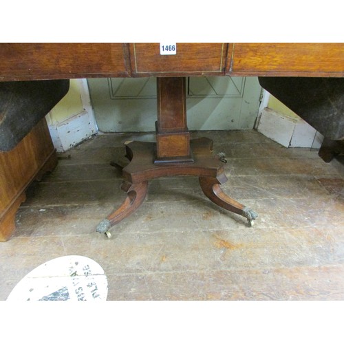 1466 - A Regency rosewood drop leaf table with brass inlaid, enclosing two frieze drawers, on a square cut ... 