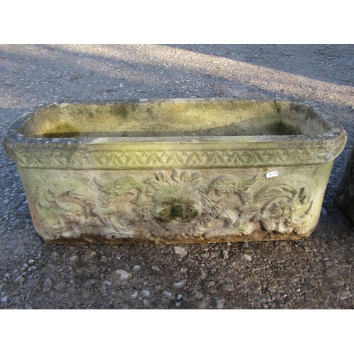 22 - A pair of weathered rectangular cast composition stone flower troughs with canted corners, lions mas... 