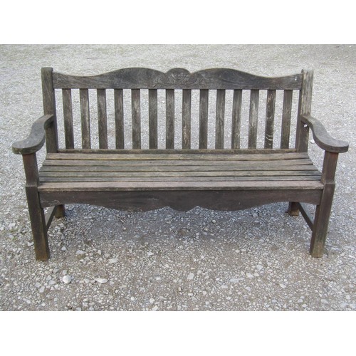 41 - A Bridgman & Co Ltd stained and weathered teak three seat garden bench 161 cm wide and a pair of mat... 