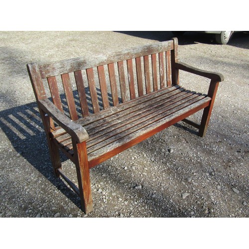 46 - A pair of good quality heavy gauge weathered teak three seat garden benches with slatted seats and b... 