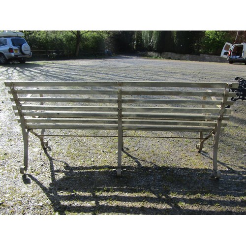 76 - A vintage painted sprung steel garden bench with slatted seat, 184cm long