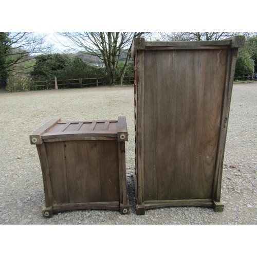 81 - A pair of stained and weathered teak garden planters with facetted square cut supports and slatted p... 